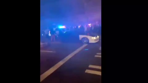 Police SUV runs over rioters