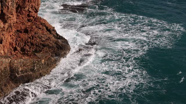 waves take rest on rock (nature relax)