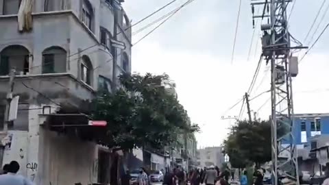 Palestinian children celebrate as Hamas fires a volley of rockets toward Israel from Gaza.