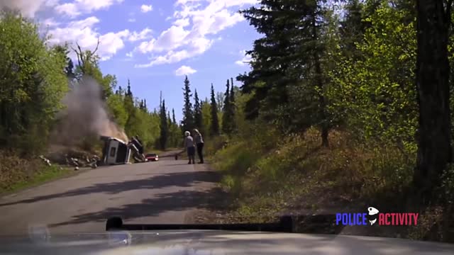 Police Dashcam Shows Dramatic Rescue Of Man From Burning SUV