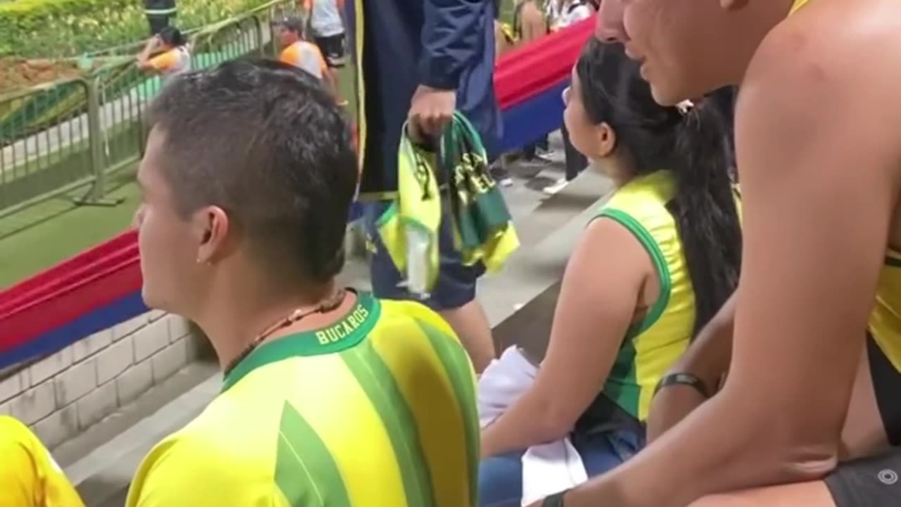 Man Helps his Blind Friend to Experience a Football Game