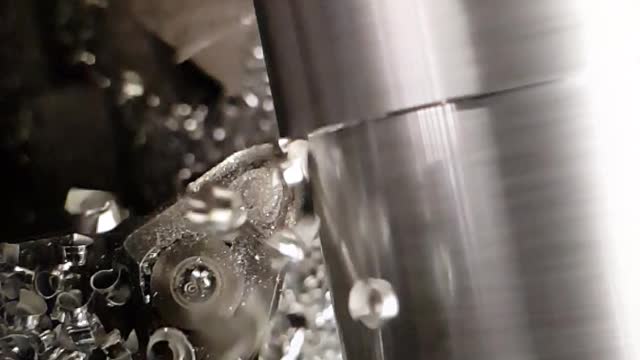 Slow motion lathe machining aluminium