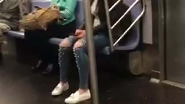 Girl with pearls on knees of jeans