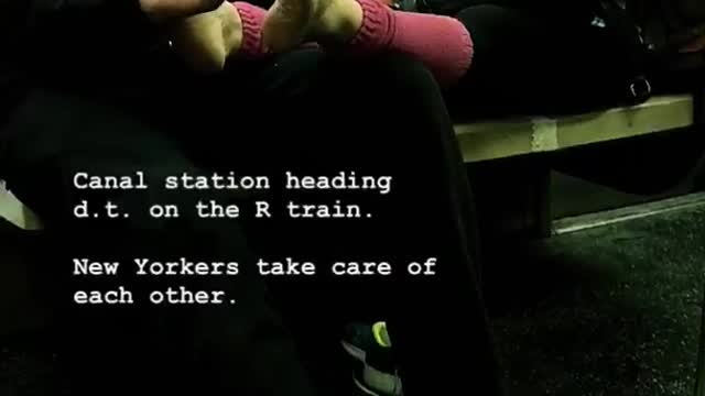 Man massages woman's bare feet on subway car