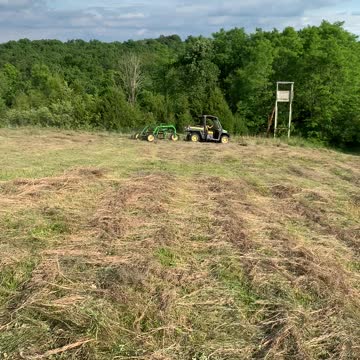 Raking hay with the John Deere Gator 835!
