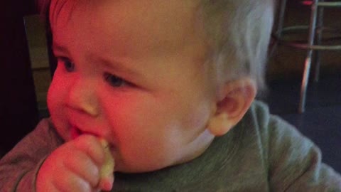 Teething baby gets a little help from Granny