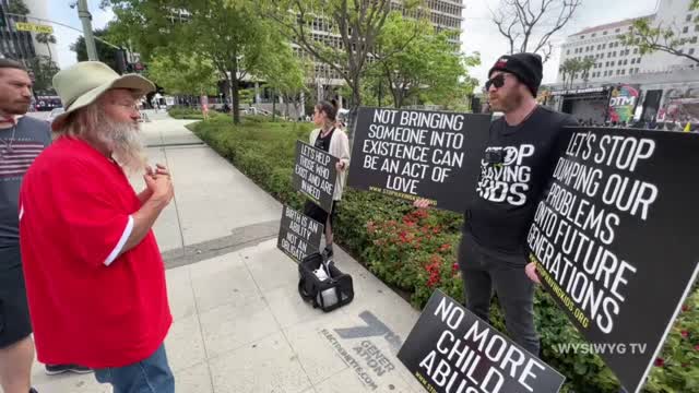 "Stop Having Kids" Street Interview at Defeat the Mandates Rally Los Angeles, CA