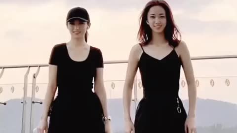 Mom and daughter dance together