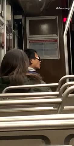 Man flicks his tongue up and down on bus