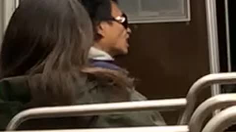 Man flicks his tongue up and down on bus