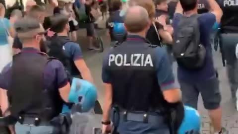 Police walking in solidarity with protestors in Italy