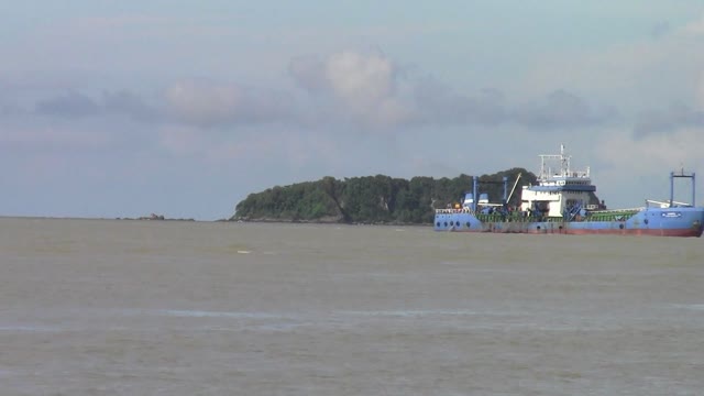 Ship passing an island at Songkhla Province, Thailand