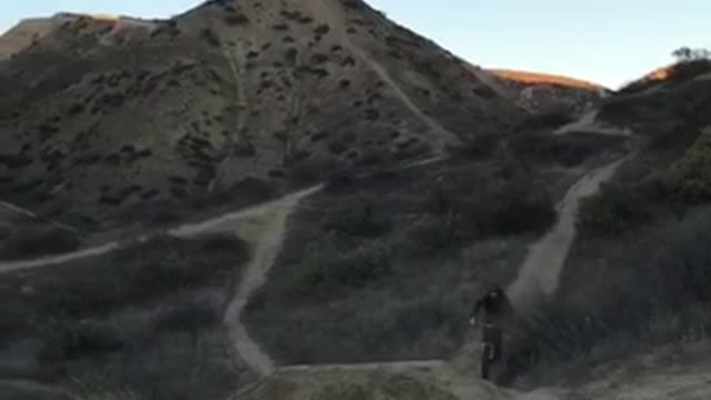 Bmx biker rides off ramp, head smashes into drone video recording