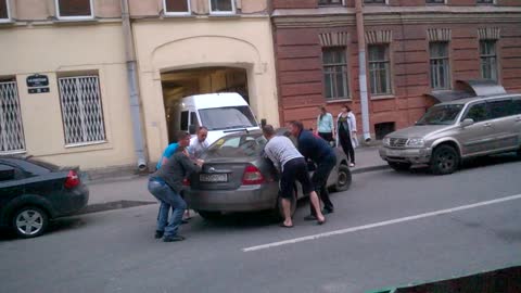 Men Move a Car that is Blocking Driveway