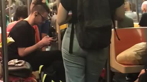 Three men on train with man buns