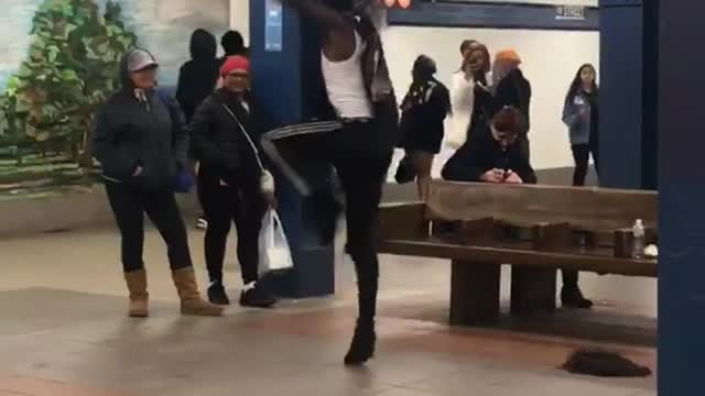 Man black outfit boots dancing subway station