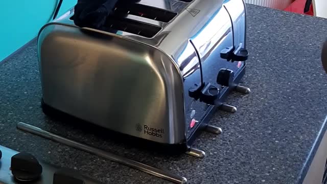 Man Dried Socks On Toaster