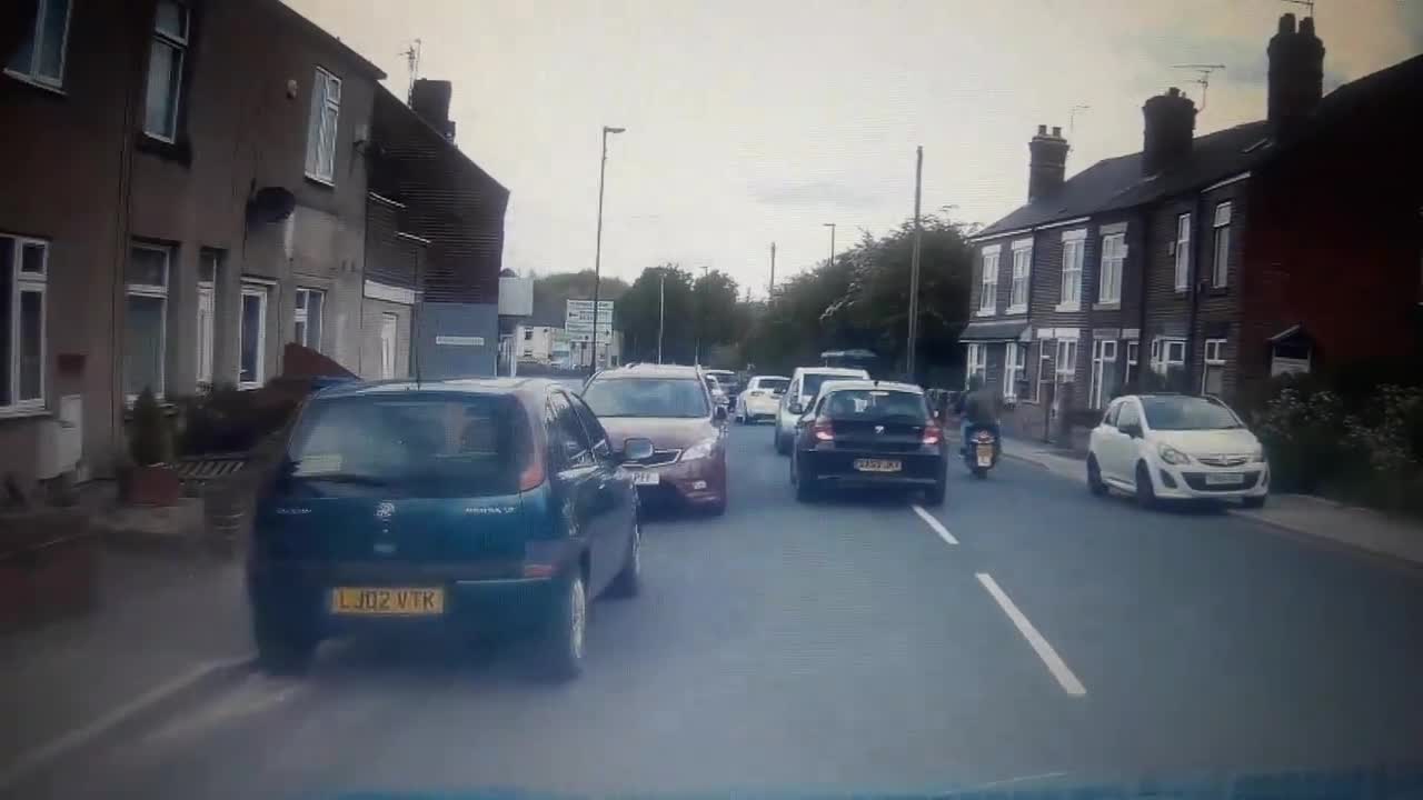 Motorcyclist almost crashes into pedestrians while driving on sidewalk