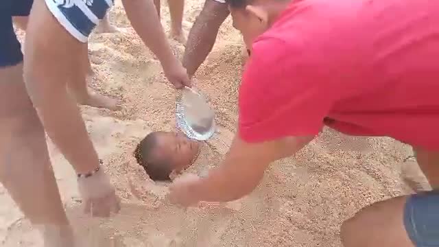 HAVING FUN WITH THIS LITTLE BOY AT THE BEACH