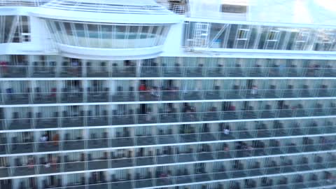 The Harmony of the Sea is sailing in Sint Maarten from the Norwegian Bliss Cruise Ship