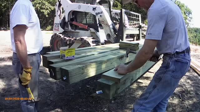 Pole barn construction, 21 posts set