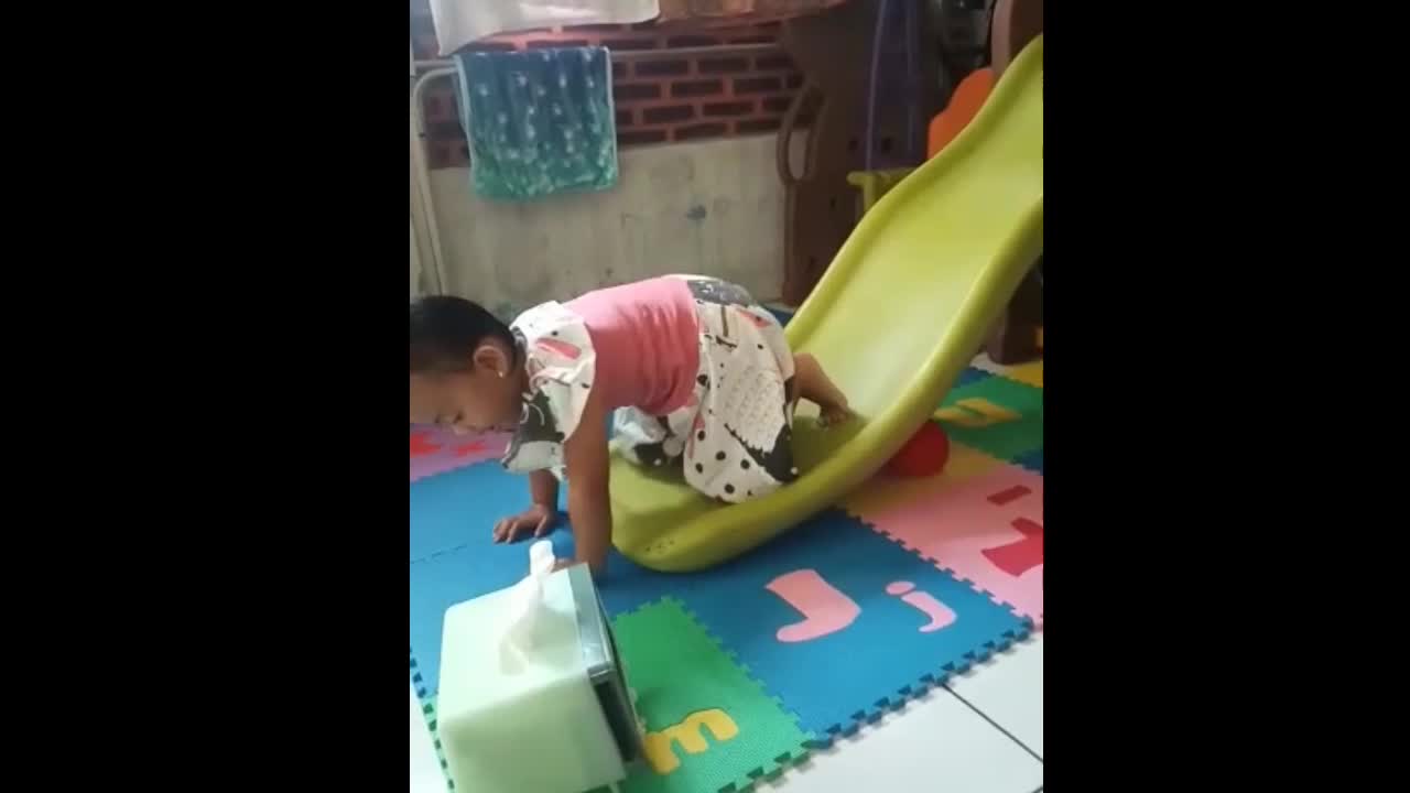 Cute Little Boy Playing Slide