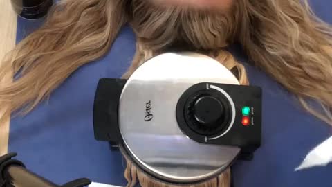 Look at the waffle iron does to her hair