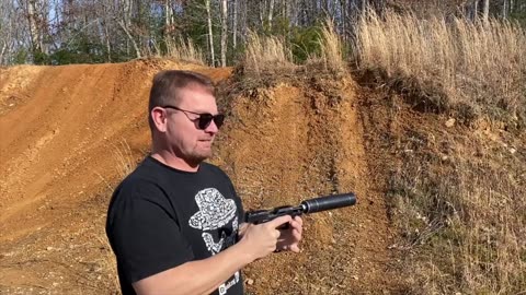 Taurus TX22 with a big suppressor