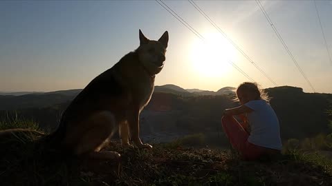 A Girl With Her Pet Dog Enjoying Nature