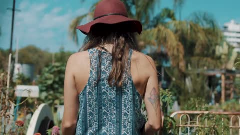 Woman walking in a nursery garden