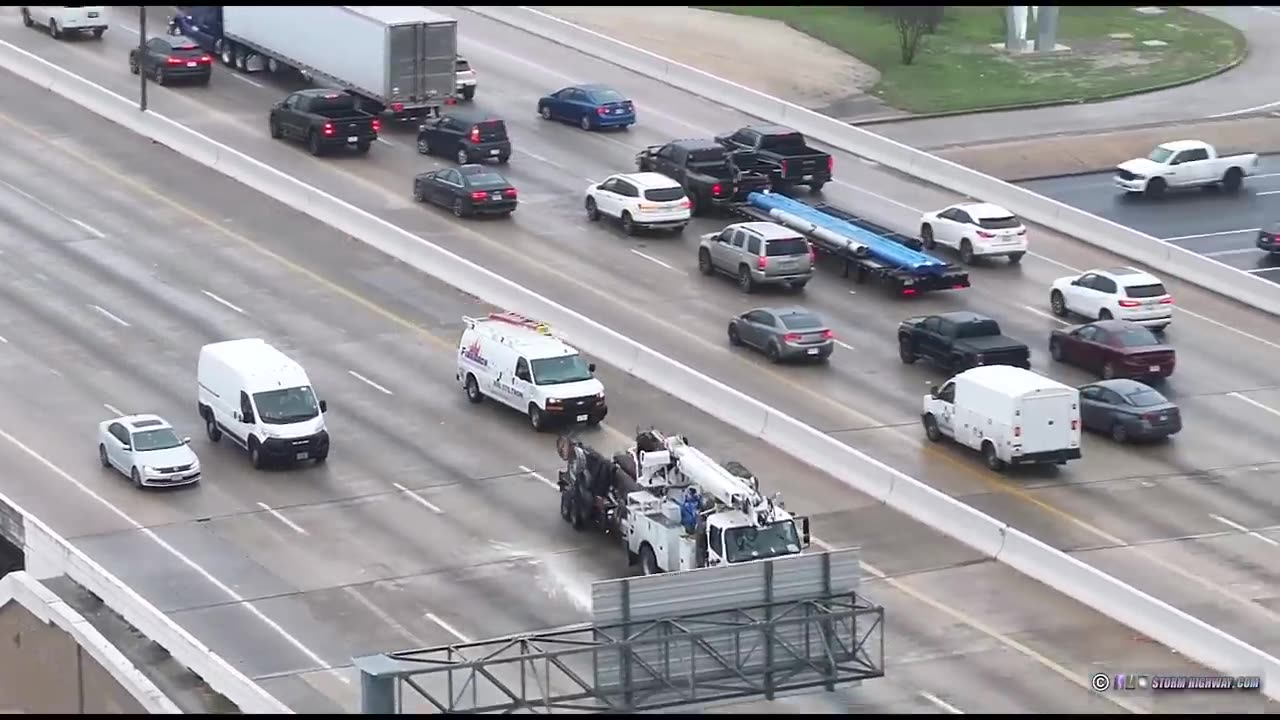 "Frozen Chaos: Drone Footage of Houston's Icy Bridge Escapades"