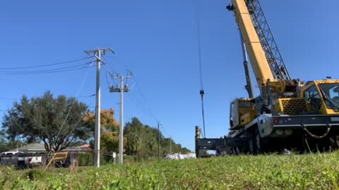 Apprentice setting 50’ power pole