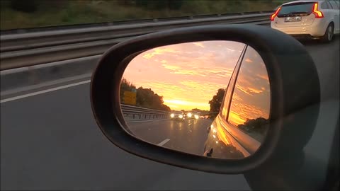 Over Taking Cars View through Rear View Mirror