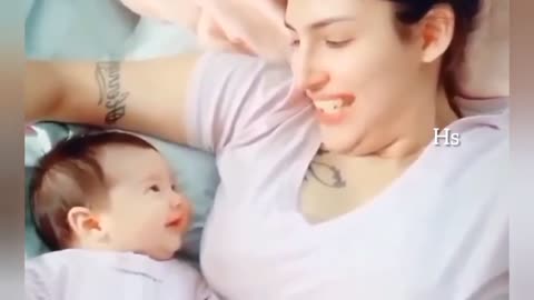 Adorable baby looking at her mom😍