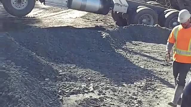 Truck gets stuck in dirt with trunk open up