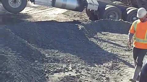 Truck gets stuck in dirt with trunk open up