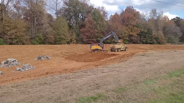 Digging a pond in clay soil, the beginning. Oh, and don't shoot arrows at my house. Part 1