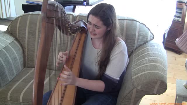 Singing In Irish And Playing The Harp