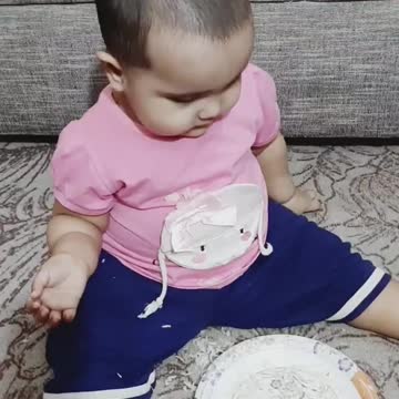 Cute baby playing with their family