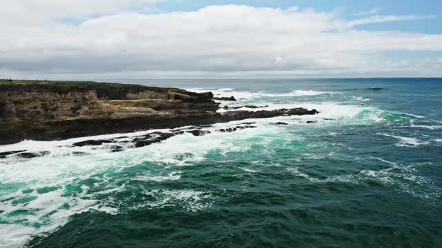 Drone Footage of Waves Crashing on Rock Formation