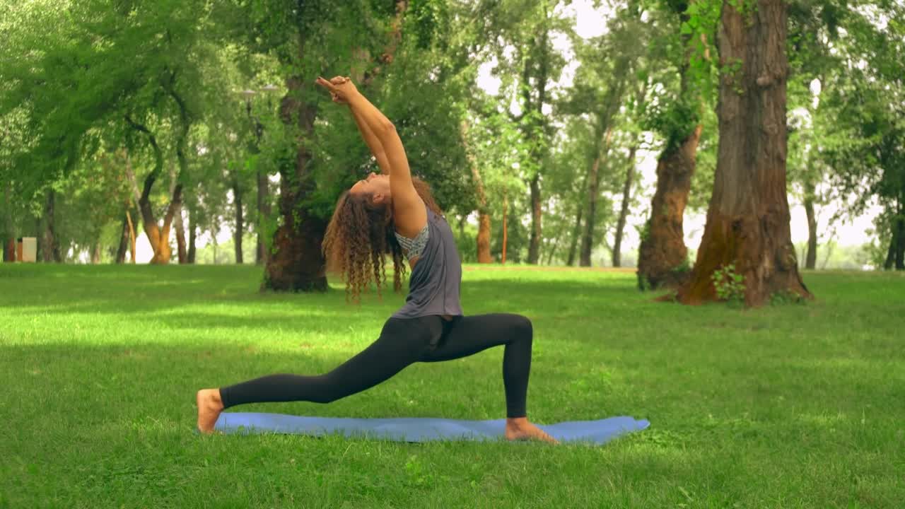 Woman doing yoga in a park