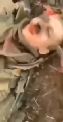 Warning Graphic: Desecration of fallen Russian Soldier
