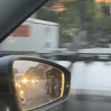 The man riding an electric scooter entering the highway