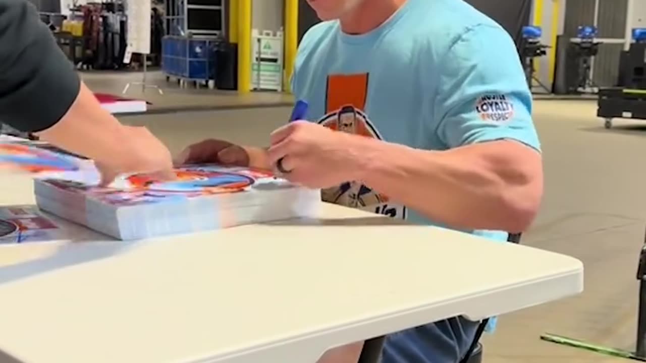 John Cena is an autographing machine