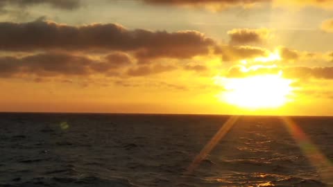 bad weather at sea accompanied by a beautiful sunset