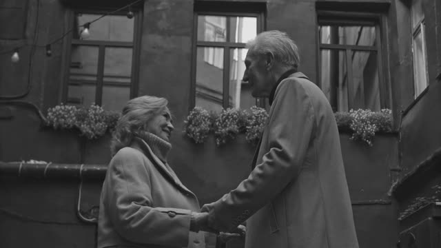 People Holding Hands in the Alley