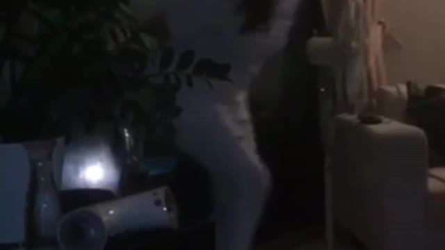 White pajamas girl in hotel jumps in friend's arms and falls down