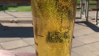 Slow motion summer cider bubbles