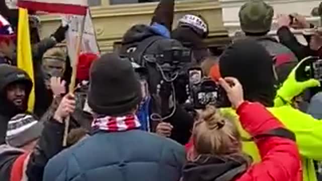 Trump Supporters pulling Antifa terrorists away from Capitol building