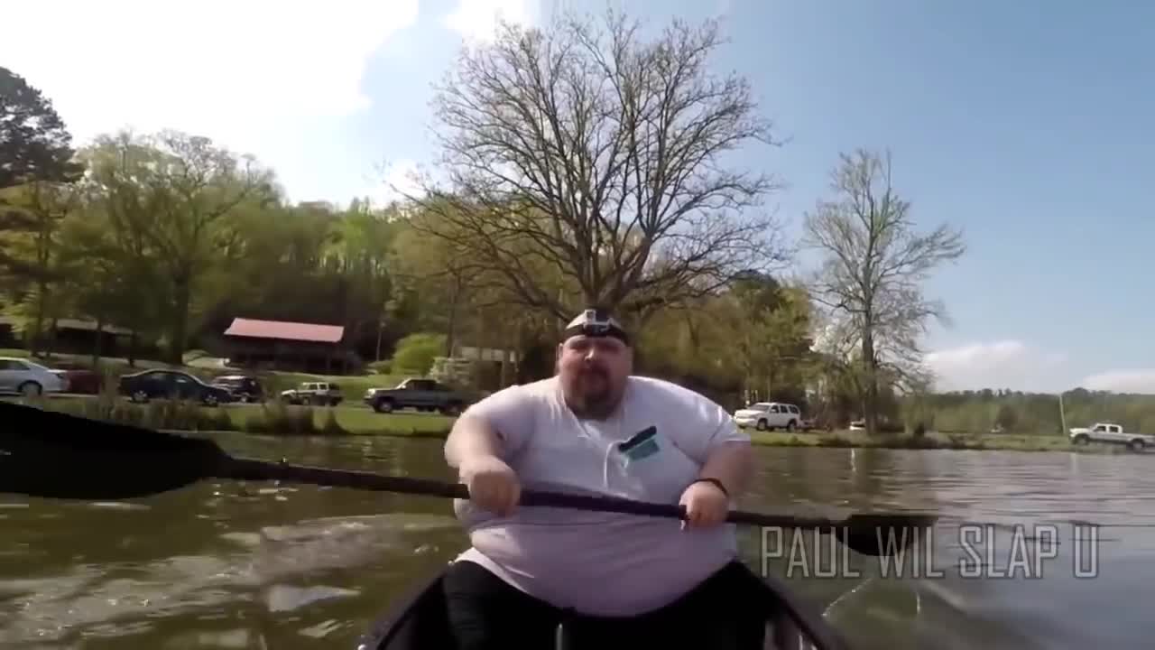 Fat guy falls off canoe.